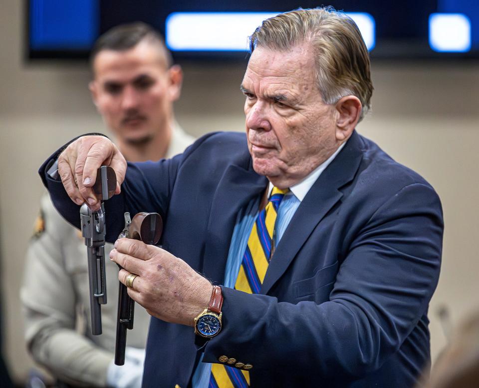 Expert witness for the defense Frank Koucky III displays a replica and a functioning gun like the one used in the "Rust" shooting for the jury to see during testimony in Hannah Gutierrez-Reed's involuntary manslaughter trial at the First Judicial District Courthouse on March 5, 2024 in Santa Fe, New Mexico.