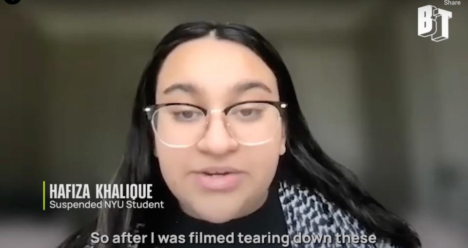A New York University student, Hafiza Khalique, suspended for removing Israeli hostage posters, has sued the university, alleging “excessive sanctions”. YouTube / BreakThrough News