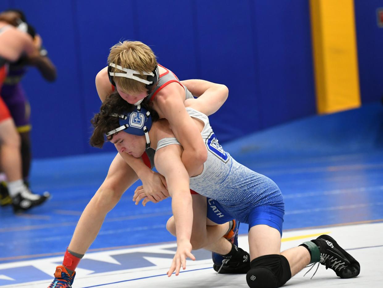 Jason Ford of Covington Catholic battles with Kevin Foster of Goshen in the second round of action at 120 pounds at the Bob Kearns Madeira Invitational Wrestling Tournament, Jan. 6, 2024.