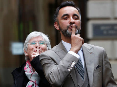 Catalonia's former education minister Clara Ponsati gestures with her lawyer Aamer Anwar after being bailed following an extradition hearing in Edinburgh, Scotland, Britain, March 28, 2018. REUTERS/Russell Cheyne