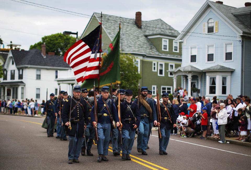 Members representing the 28th Massachusetts Regiment wearing uniforms from the United States Civil War march in a Memorial Day parade to ceremonies at Cedar Grove Cemetery in Boston, Massachusetts May 26, 2014. (REUTERS/Brian Snyder)