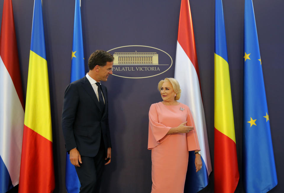 Dutch Prime Minister Mark Rutte, left, speaks with his Romanian counterpart Viorica Dancila at the Victoria Palace in Bucharest, Romania, Wednesday, Sept. 12, 2018. Rutte is on a one day official visit to Romania.(AP Photo/Vadim Ghirda)