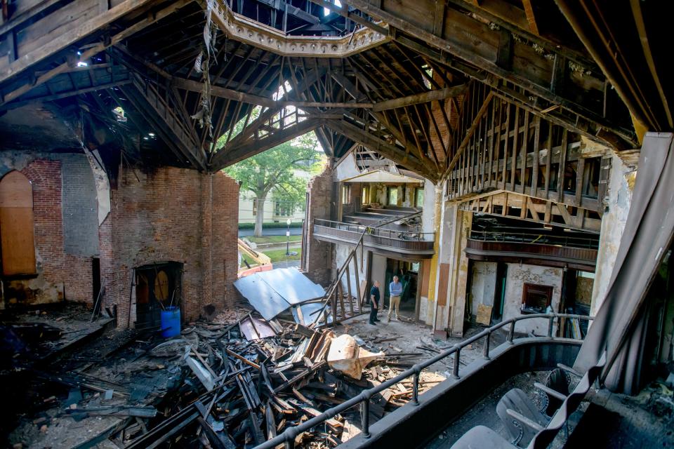 East Peoria attorney Clay Moushon, left, and Greg Birkland, president and CEO of the KDB Group, take a look around the partially demolished interior of the historic Hale Memorial Church on Thursday, Aug. 25, 2022 at the corner of Main and High streets in Peoria.