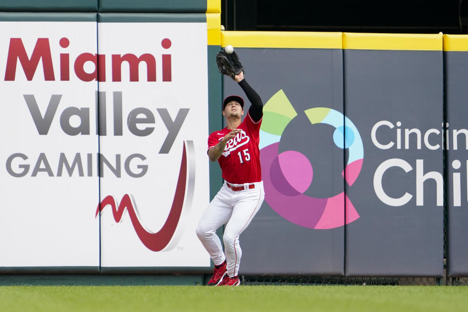 Cincinnati Reds center fielder Nick Senzel (15) catches a fly ball hit by Washington Nationals' Juan Soto during the first inning of a baseball game Saturday, June 4, 2022, in Cincinnati. (AP Photo/Jeff Dean)