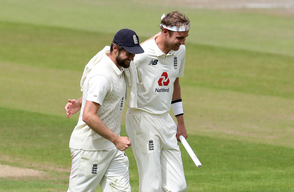 England's Chris Woakes (left) and Stuart Broad smile and embrace at the end of day five.