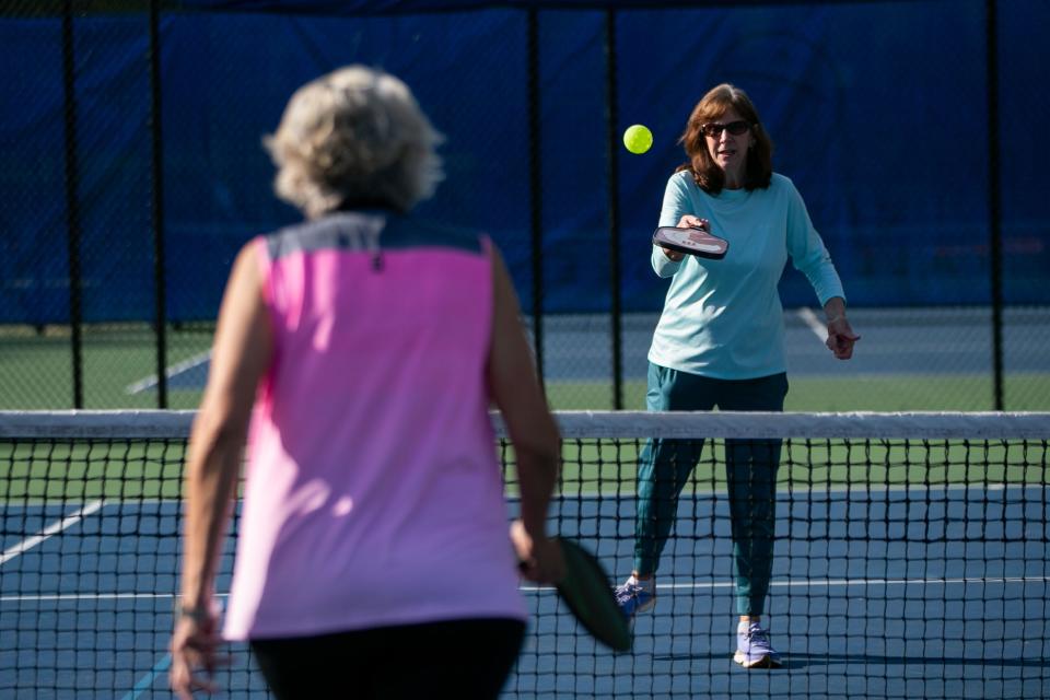 Dede Dawson plays pickleball with her friends at Winthrop Park on Friday, March 31, 2023. 