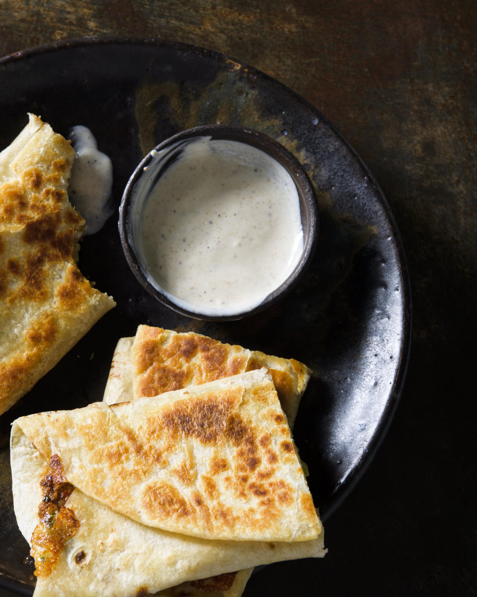 This image released by Milk Street shows a recipe for Beef Spinach Feta Gozleme. (Milk Street via AP)