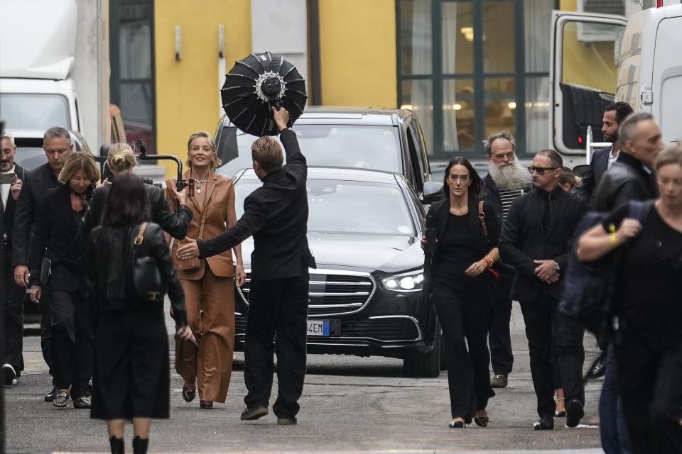 Sharon Stone, centre left, arrives for the Tod's women's Spring Summer 2024 collection presented in Milan, Italy, Friday, Sept. 22, 2023. (AP Photo/Luca Bruno)