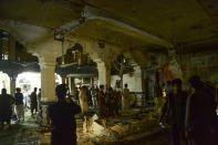 <p>Afghan security personel inspect the site of a suicide bomb attack at a Shiite mosque in Herat on August 1, 2017. (Photo: Hoshang Hashimi/AFP/Getty Images) </p>