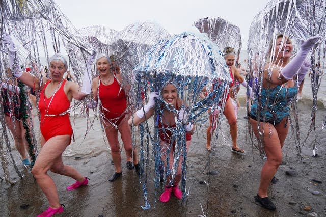 Members of the Bray Beach Bathers leave the water