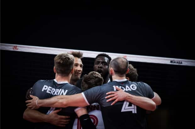 Canada's men's volleyball team celebrates a point during its three-set sweep of the Netherlands in Volleyball Nations League action on Monday in Rimini, Italy. (Volleyball World - image credit)