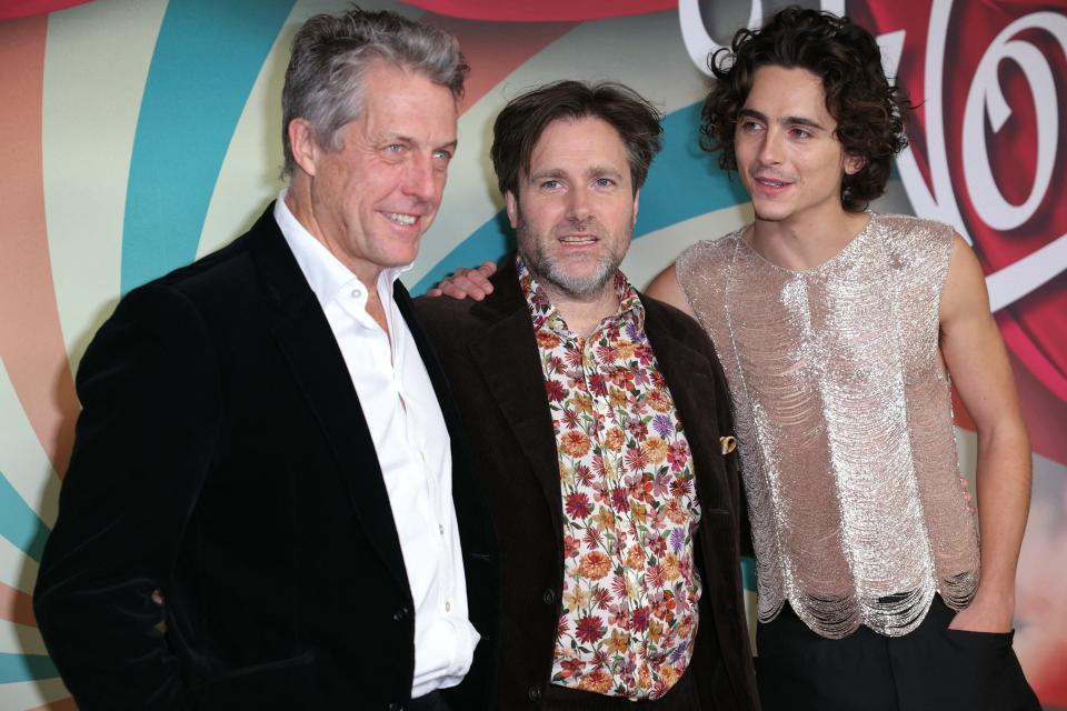 Hugh Grant with "Wonka" director Paul King and lead star Timothee Chalamet.