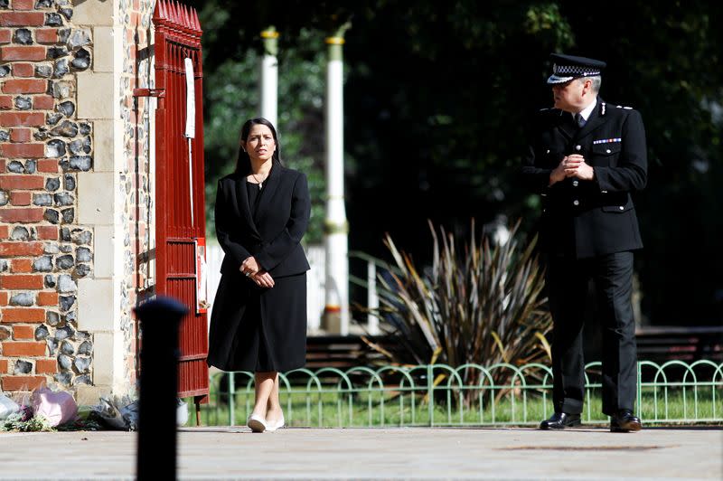 Britain's Home Secretary Priti Patel and Thames Valley Police Chief Constable, John Campbell are pictured near to the scene of reported multiple stabbings in Reading