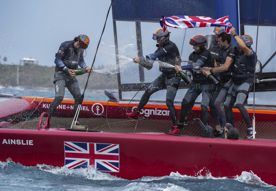 In this photo provided by SailGP, the Britain SailGP Team presented by INEOS, helmed by Sir Ben Ainslie, celebrate their win in the final race on race Day 2 of the Bermuda SailGP event in Hamilton, Bermuda, Sunday, April 25, 2021. (Bob Martin/SailGP via AP)