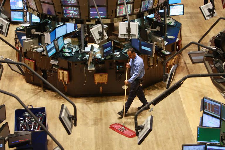 NEW YORK - SEPTEMBER 15:  A custodian cleans up the floor of the New York Stock Exchange September 15, 2008 in New York City.In afternoon trading the Dow Jones Industrial Average fell over 500 points as U.S. stocks suffered a steep loss after news of Merrill Lynch & Co. Inc was selling itself to Bank of America Corp, the financial firm Lehman Brothers Holdings Inc. filed for Chapter 11 bankruptcy protection, and insurance giant American International Group Inc. (AIG) was approved to secure capital from itself.  (Photo by Spencer Platt/Getty Images)