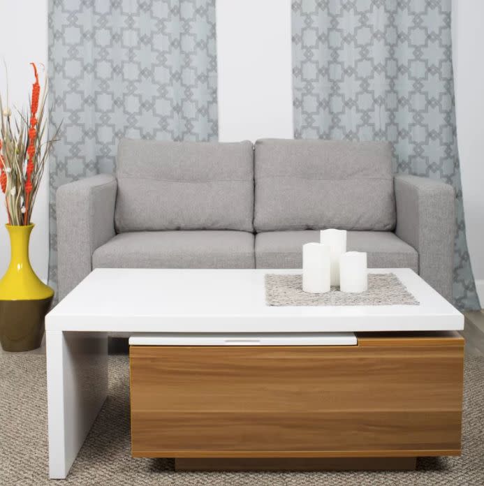 The 360-degree swivel of this <a href="https://www.wayfair.com/furniture/pdp/matrix-lift-top-coffee-table-mtrx1135.html" target="_blank">hidden compartment coffee table</a> will accommodate the layout of your space no matter how big or small.