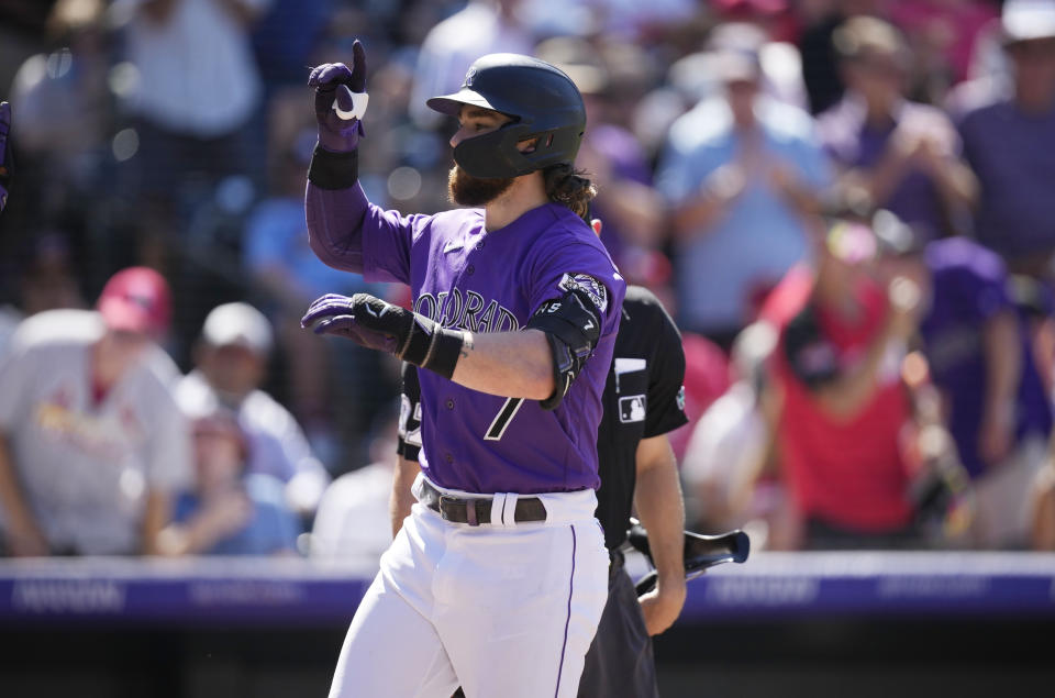 Colorado Rockies' Brendan Rodgers gestures as he crosses home plate after hitting a three-run home run off St. Louis Cardinals relief pitcher Genesis Cabrera in the seventh inning of a baseball game Thursday, Aug. 11, 2022, in Denver. (AP Photo/David Zalubowski)