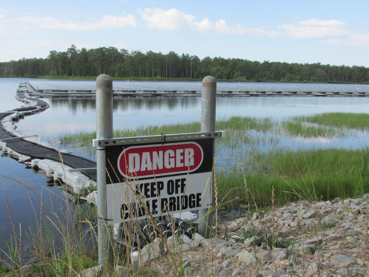 Solar panels on nearly 2 surface acres of Big Muddy Lake at Camp Mackall are part of a clean energy project collaboration between Fort Bragg, Duke Energy and Ameresco and is the first project of its kind for the Department of Defense.