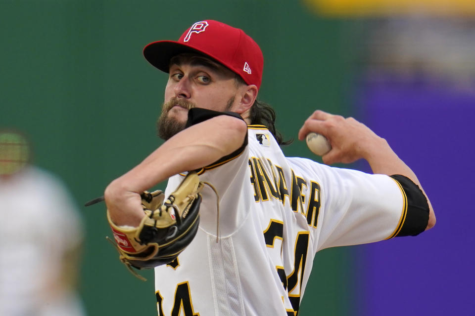 Pittsburgh Pirates starting pitcher JT Brubaker delivers during the first inning of the team's baseball game against the Milwaukee Brewers in Pittsburgh, Friday, July 2, 2021. (AP Photo/Gene J. Puskar)