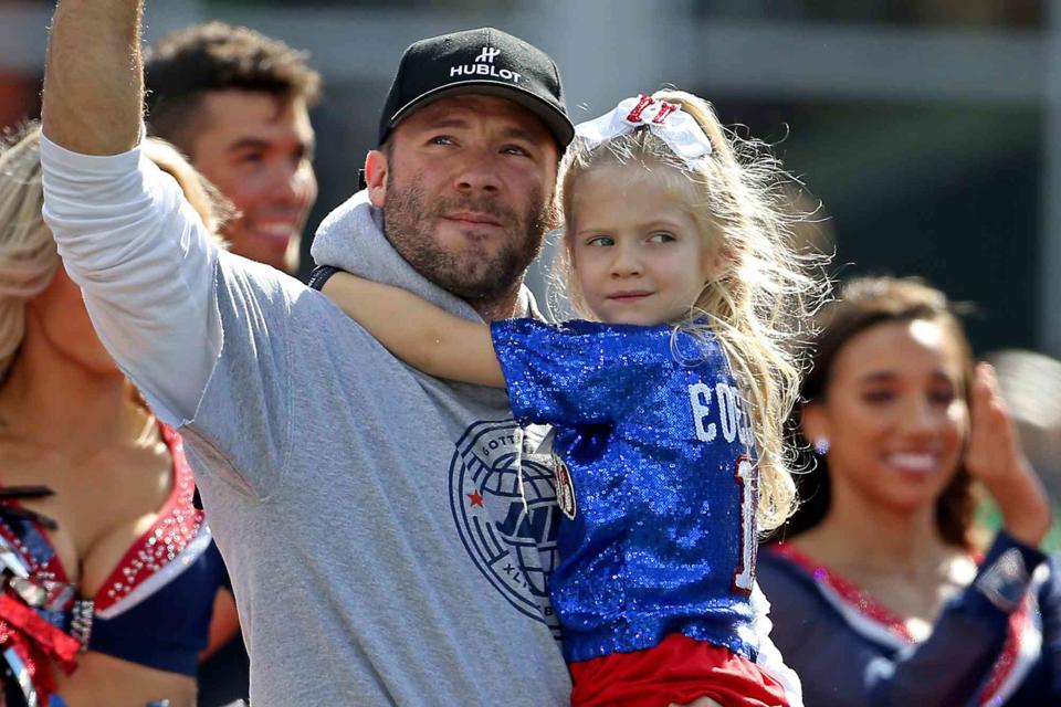 <p>Matt Stone/MediaNews Group/Boston Herald/Getty</p> Julian Edelman holds his daughter Lily Rose  at half time of the NFL game against the New Orleans Saints at Gillette Stadium on September 26, 2021.