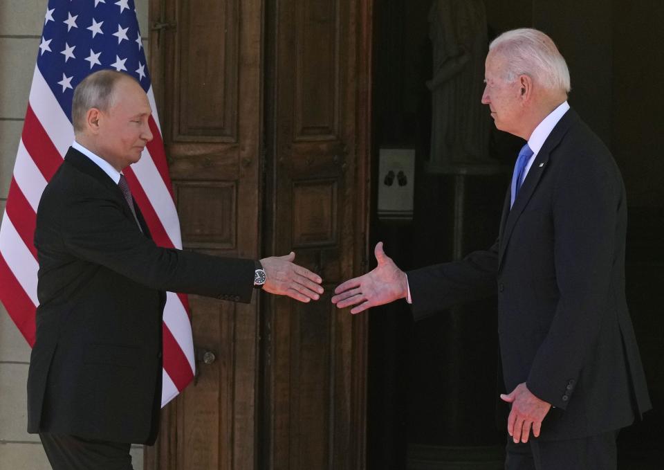 FILE - Russian President Vladimir Putin, left, and U.S President Joe Biden shake hands at a meeting at the 'Villa la Grange' in Geneva, Switzerland, on Wednesday, June 16, 2021. Arrests of Americans in Russia have become increasingly common as relations between Moscow and Washington sink to Cold War lows. Some have been exchanged for Russians held in the U.S., while for others, the prospects of being released in a swap are less clear. (AP Photo/Alexander Zemlianichenko, Pool, File)