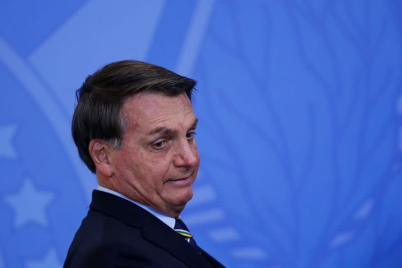 FILE PHOTO: Brazil's President Jair Bolsonaro looks on during an inauguration ceremony of the new Communications Minister Fabio Faria (not pictured) at the Planalto Palace, in Brasilia