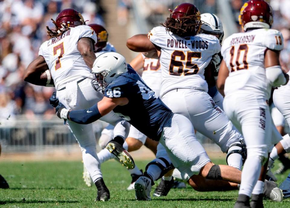 Penn State defensive end Nick Tarburton stops Central Michigan’s Lew Nichols III during the game on Saturday, Sept. 24, 2022.