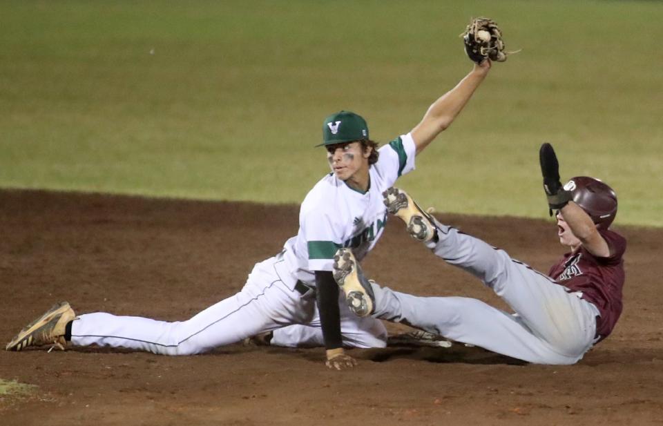 Venice High's Marek Houston holds the ball up after tagging Riverview High's Chris Barr out on a stolen base attempt during a game this past season. COURTESY PHOTO