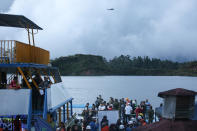 <p>Rescue officials search for survivors after the tourist boat Almirante sank in the Reservoir of Penol in Guatape municipality in Antioquia on June 25, 2017. (Joaquin Sarmiento/AFP/Getty Images) </p>