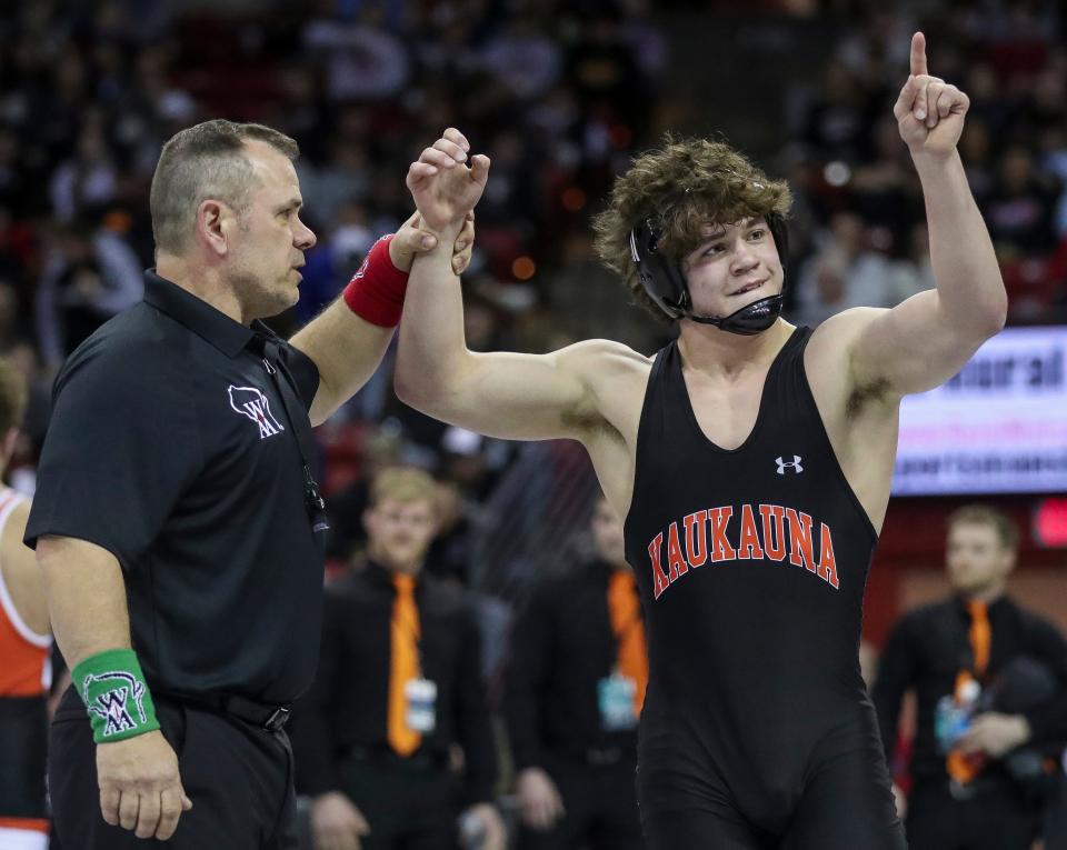 Kaukauna's Liam Crook celebrates after defeating Marshfield's Caleb Dennee in a Division 1 165-pound championship match during the WIAA state individual wrestling tournament Saturday at the Kohl Center in Madison.