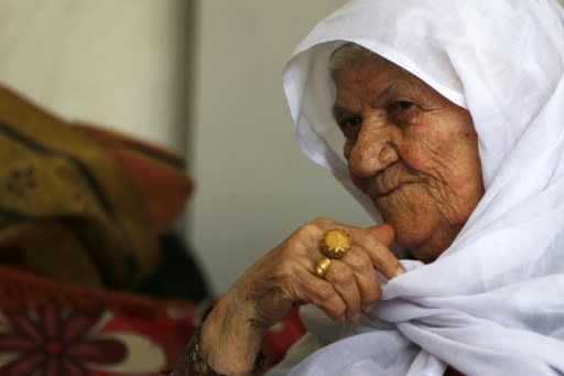 Palestinian refugee Khadija Sharkawi, 85, sits at her home in the Amari refugee camp near the West Bank city of Ramallah. She is among around five million refugees who want to return to their lands in what is now Israel