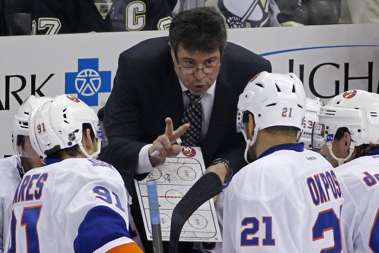 New York Islanders coach Jack Capuano gives instructions during the third period of an NHL hockey game against the Pittsburgh Penguins in Pittsburgh, Saturday, Oct. 18, 2014. The Penguins won 3-1. (AP Photo/Gene J. Puskar)