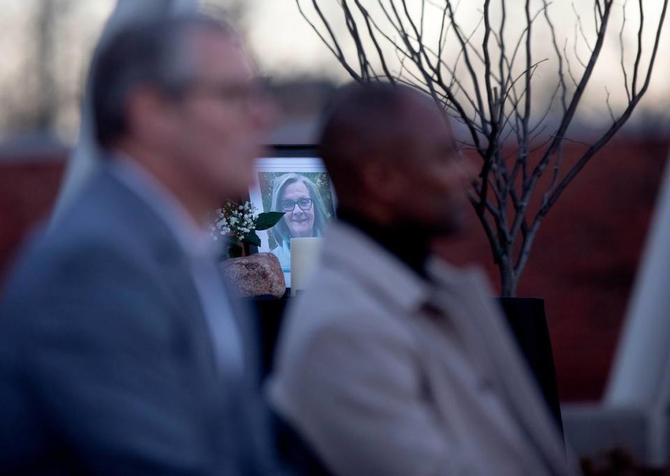 A photograph of Nancy Taylor sits on a table during a vigil held outside the Apex Town Hall on Monday, Jan. 29, 2024, to honor Taylor and Gabrielle Raymond, who were shot and killed in an Apex neighborhood on Jan. 15.