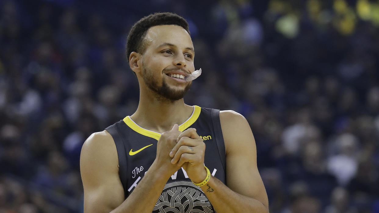 Steph Curry responded to a young fan who wanted to know why his Under Armour sneakers don’t come in sizes for girls. (AP Photo/Jeff Chiu)