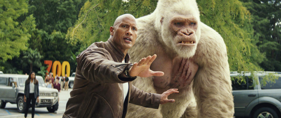 Dwayne Johnson with his white gorilla sidekick, George