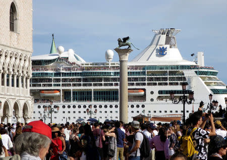 FILE PHOTO: A cruise ship is seen in Venice lagoon passing beside the Piazetta next to the Piazza San Marco (St.Mark's square) in Venice, Italy, June 18, 2016. REUTERS/Fabrizio Bensch /File Photo