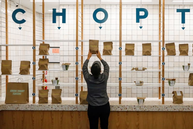 A worker sets out an order for pickup at the newest Chopt Creative Salad Co., location in New York