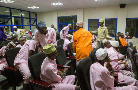 Unidentified suspects are seen inside the Rwandan high court after being convicted of belonging to extremist groups including al Shabaab and Islamic State and providing them support, in Nyanza, Rwanda March 22, 2019. REUTERS/Jean Bizimana