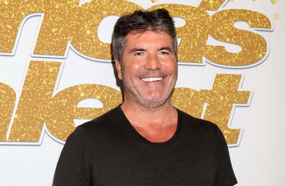 Simon Cowell was desperate to own the rights to what would become Britney Spears' debut single credit:Bang Showbiz