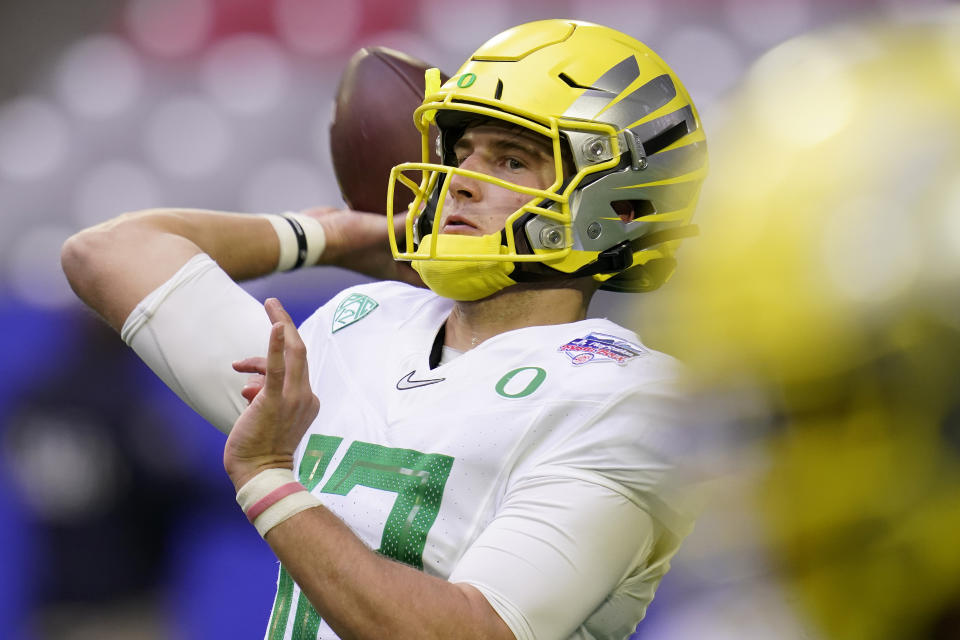 Oregon quarterback Tyler Shough (12) warms up prior to the Fiesta Bowl NCAA college football game against Iowa State, Saturday, Jan. 2, 2021, in Glendale, Ariz. (AP Photo/Ross D. Franklin)