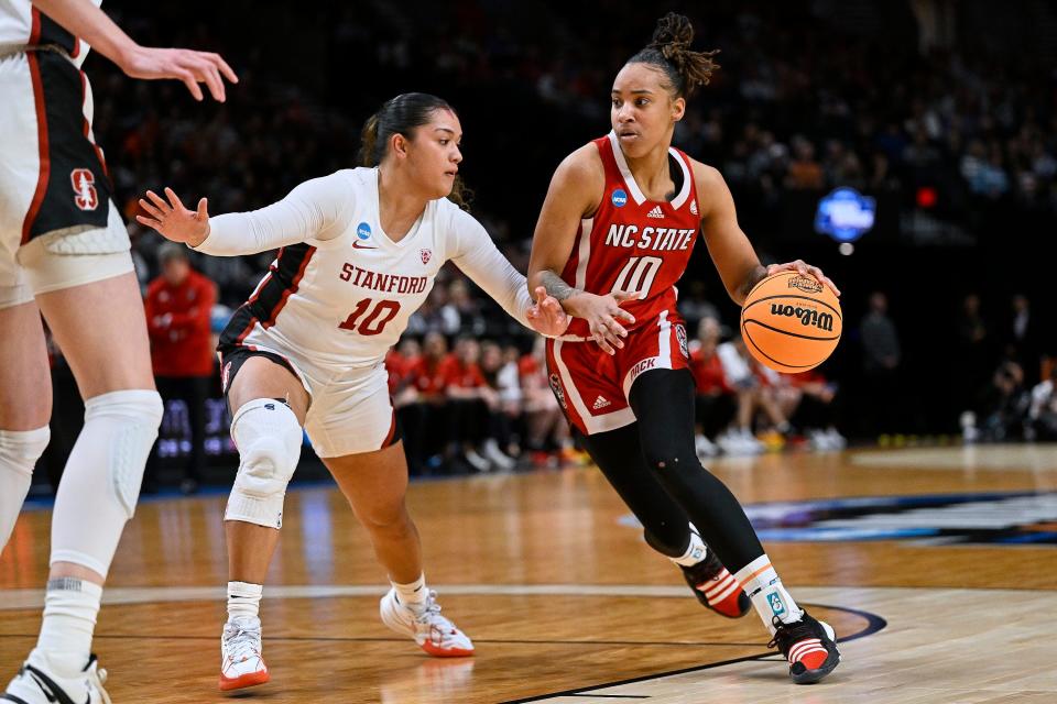 North Carolina State guard Aziaha James drives to the basket against Stanford in the Wolfpack's Sweet 16 win Friday. James has been on an NCAA Tournament tear, scoring 70 points through the first three games, including a 29-point effort against the Cardinal.