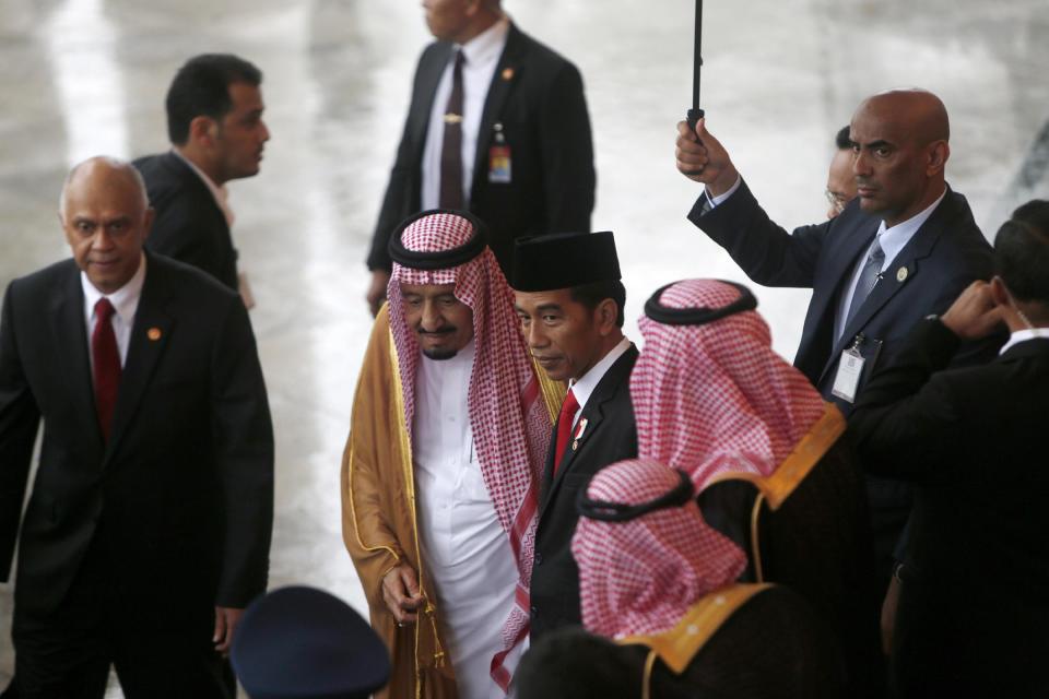 Indonesian President Joko Widodo, center right, greets Saudi Arabia's King Salman, center left, at the presidential palace in Bogor, West Java, Indonesia, Wednesday, March 1, 2017. Salman arrived in the world's largest Muslim nation on Wednesday as a part of a multi-nation tour aimed at boosting economic ties with Asia. (Adi Weda, Pool Photo via AP)