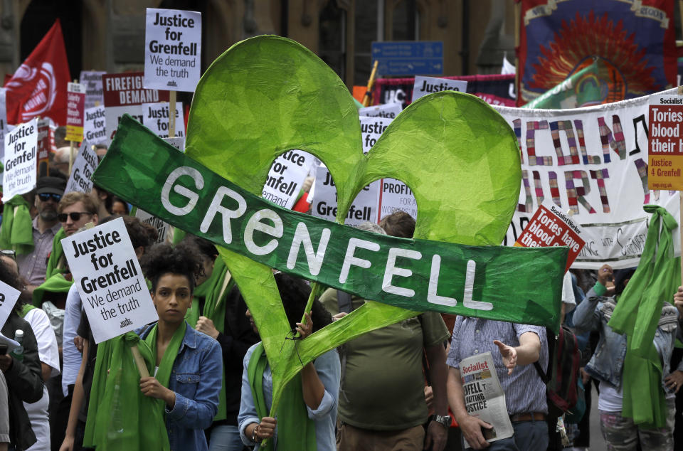 Demonstrators march in the Grenfell fire one-year anniversary solidarity march organised by Justice4Grenfell. (AP Photo/Kirsty Wigglesworth)