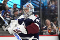 Colorado Avalanche goaltender Justus Annunen heads to the crease after starting goaltender Alexandar Georgiev was pulled in the second period of an NHL hockey game against the Nashville Predators Saturday, March 30, 2024, in Denver. (AP Photo/David Zalubowski)