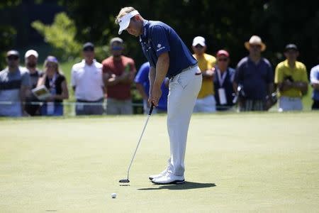 Jun 25, 2016; Bethesda, MD, USA; Billy Hurley III of the United States putts on the fourth hole during the third round of the Quicken Loans National golf tournament at Congressional Country Club - Blue Course. Mandatory Credit: Geoff Burke-USA TODAY Sports