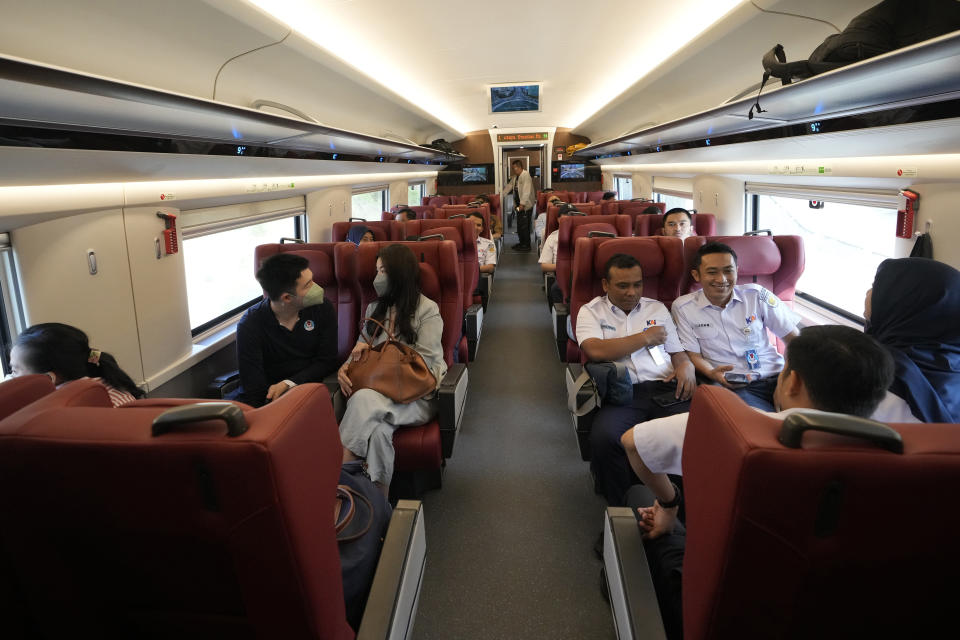 FOR SUNDAY - People sit inside a high-speed train during a test ride at Halim station in Jakarta, Indonesia, on Sept. 18, 2023. Indonesia sets to launch Southeast Asia's first high-speed railway, a key project under China's Belt and Road infrastructure initiative that will cut travel time between two cities from the current three hours to about 40 minutes. (AP Photo/Achmad Ibrahim)