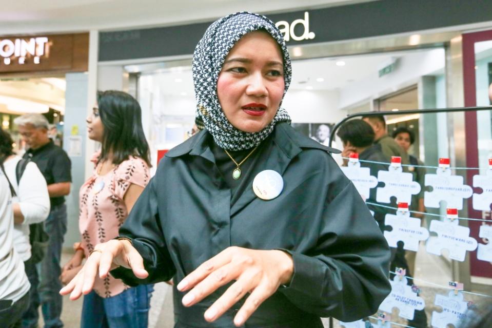 MH370 flight steward Mohd Hazrin Mohamed Hasnan’s spouse Intan Maizura Othaman speaks to Malay Mail during the 10th year commemoration of the disappearance of MH370 in Subang Jaya March 3, 2024. — Picture by Miera Zulyana 