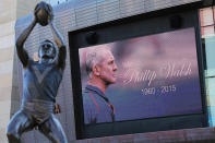 Phil Walsh is honoured on the video board outside Adelaide Oval.