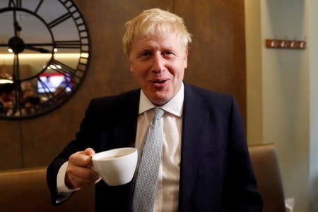 FILE PHOTO: Boris Johnson, a leadership candidate for Britain's Conservative Party, visits a tea shop in Oxshott