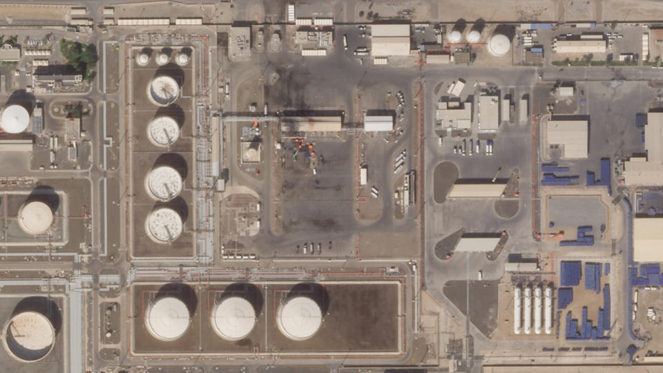 This satellite image provided Planet Labs PBC shows the aftermath of an attack claimed by Yemen's Houthi rebels on an Abu Dhabi National Oil Co. fuel depot in the Mussafah neighborhood of Abu Dhabi, United Arab Emirates, Saturday, Jan. 22, 2022. The United Arab Emirates intercepted two ballistic missiles targeting Abu Dhabi in a new attack early Monday, Jan. 24, 2022, its state-run news agency reported, the latest attack to target the Emirati capital. No group immediately claimed responsibility but suspicion immediately fell on the Houthis. (Planet Labs PBC via AP)